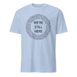 We're Still Here Tribal Listing Light Blue Unisex T-shirt by Wayuką́